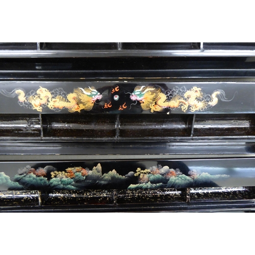 44 - A set of six black lacquered combination Mah-jong tiles/gaming counter racks, decorated with dragons... 