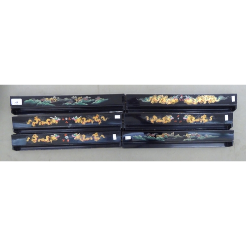 44 - A set of six black lacquered combination Mah-jong tiles/gaming counter racks, decorated with dragons... 