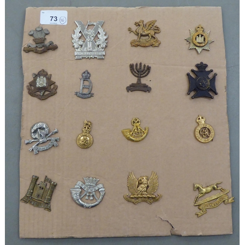 73 - Sixteen regiments cap badges and other insignia, some copies: to include Tyneside Scottish, East Sur... 