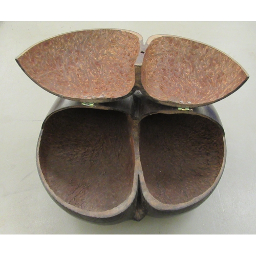 76 - A Coco de Mer shell, fashioned as a cutlery tray with two hinged compartments  14