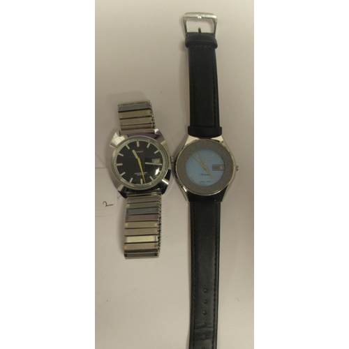 84 - Wristwatches: to include a vintage Timex automatic example, faced by a black baton dial with a date ... 