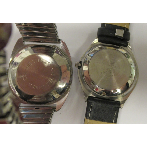 84 - Wristwatches: to include a vintage Timex automatic example, faced by a black baton dial with a date ... 