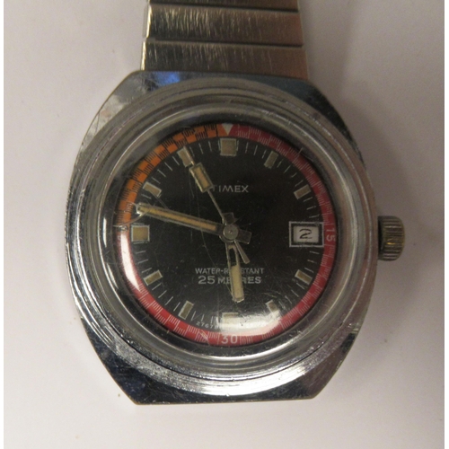 88 - A vintage Times automatic stainless steel cased divers watch, faced by a baton dial with a date aper... 