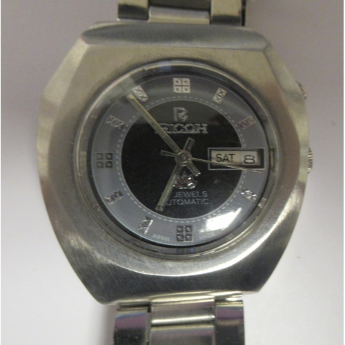 98 - A vintage Ricoh automatic stainless steel cased bracelet watch, faced by a bi-coloured baton dial wi... 