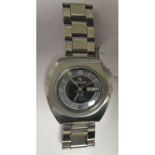 98 - A vintage Ricoh automatic stainless steel cased bracelet watch, faced by a bi-coloured baton dial wi... 