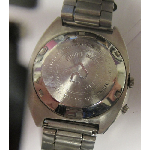 98 - A vintage Ricoh automatic stainless steel cased bracelet watch, faced by a bi-coloured baton dial wi... 