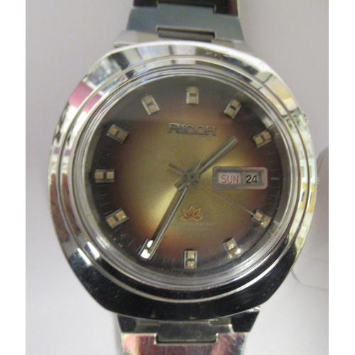 99 - A vintage Ricoh automatic stainless steel cased bracelet watch, faced by a shaded brown baton dial&n... 