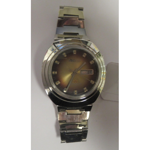 99 - A vintage Ricoh automatic stainless steel cased bracelet watch, faced by a shaded brown baton dial&n... 