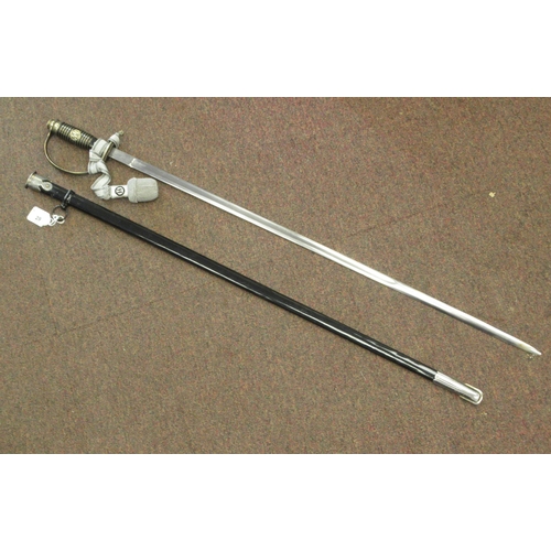 123 - A German SS dress sword with a silvered tassel, the blade 32.5