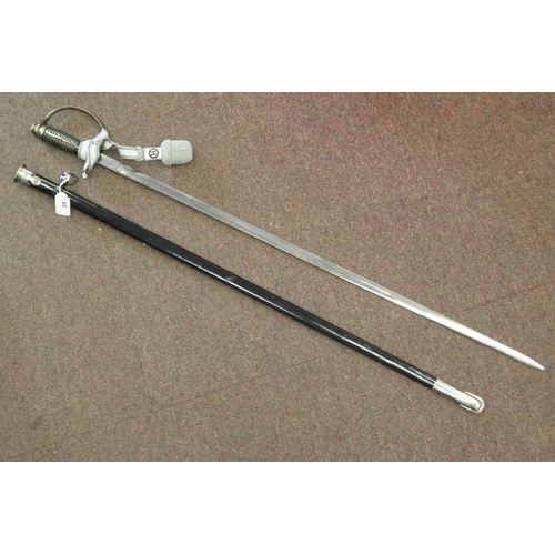 123 - A German SS dress sword with a silvered tassel, the blade 32.5