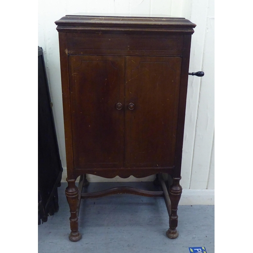 12 - A His Masters Voice, model 156, mahogany gramophone, raised on turned legs  36