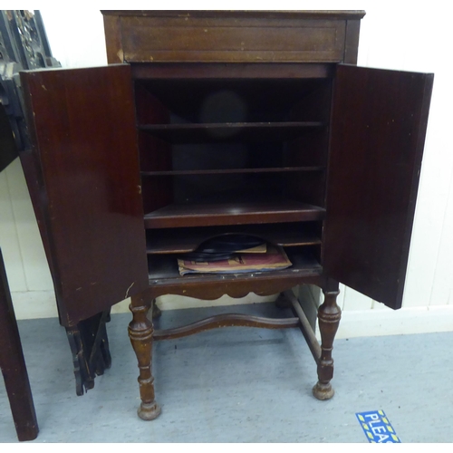 12 - A His Masters Voice, model 156, mahogany gramophone, raised on turned legs  36