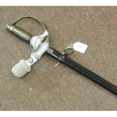 123 - A German SS dress sword with a silvered tassel, the blade 32.5