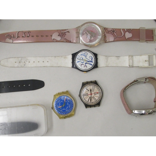 142 - Variously cased and strapped Swatch wristwatches