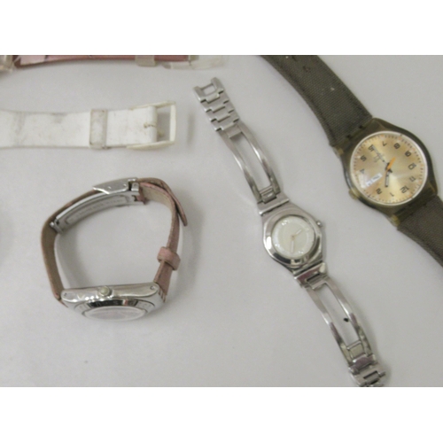 142 - Variously cased and strapped Swatch wristwatches