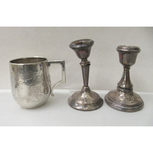 145 - Silver and white metal collectables: to include a beaker  stamped 800; and a silver photograph ... 