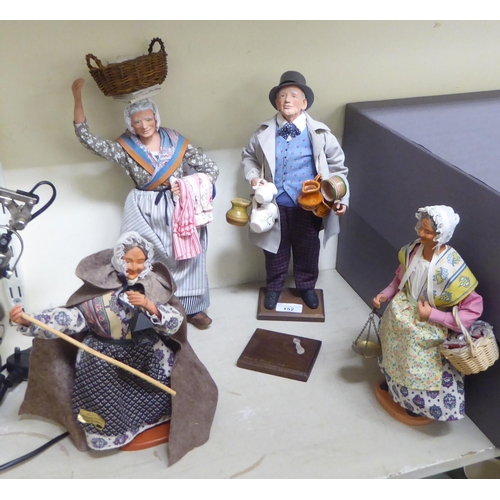 152 - Continental pottery figures: to include a Salesman  14