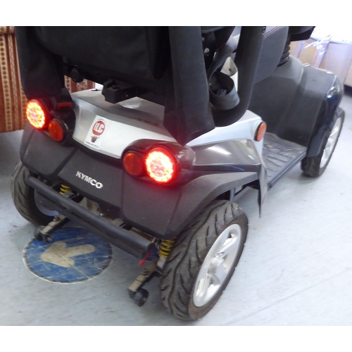 161 - A Kymco battery powered, four wheeled mobility scooter with variable speed, digital dash display, fr... 