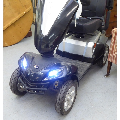 161 - A Kymco battery powered, four wheeled mobility scooter with variable speed, digital dash display, fr... 