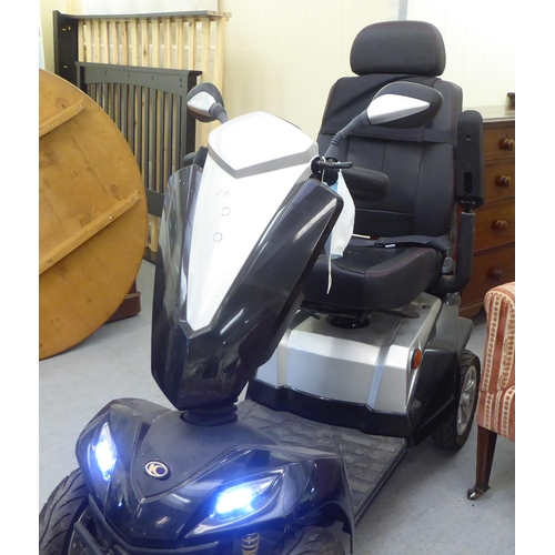 161 - A Kymco battery powered, four wheeled mobility scooter with variable speed, digital dash display, fr... 