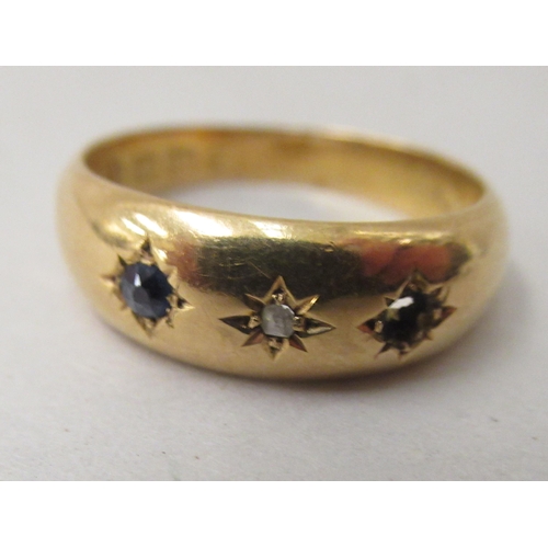 170 - An 18ct gold variously set band ring