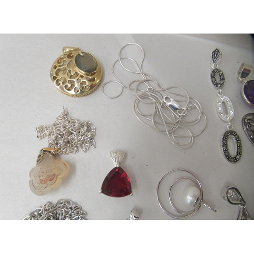 174 - Costume jewellery: to include white metal pendants and earrings 