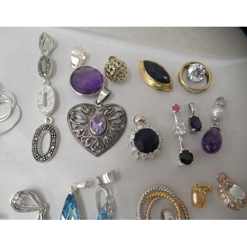 174 - Costume jewellery: to include white metal pendants and earrings 