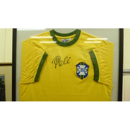 1 - A framed Brazilian football shirt  bears a pen signature  size medium  22