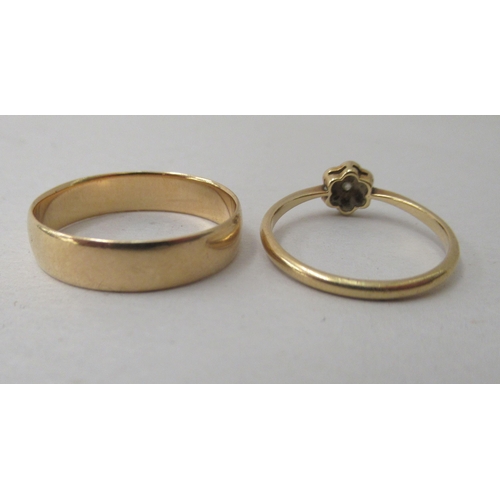 188 - Two 18ct gold rings, viz. a wedding ring; and a cluster ring 