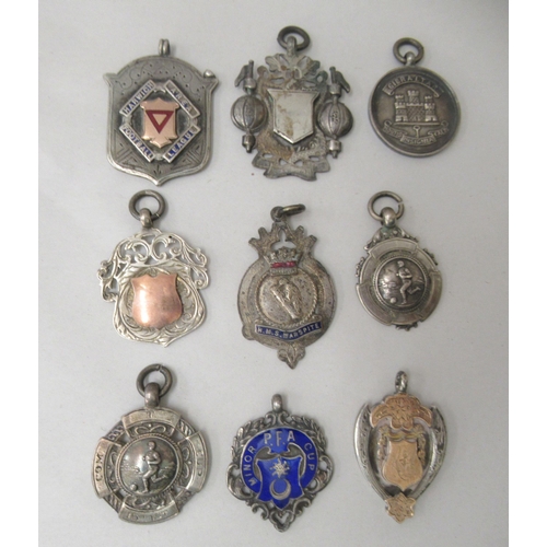 202 - WITHDRAWNNine various early 20thC silver sports trophy medallions: to include 'The Hudson League'; '... 