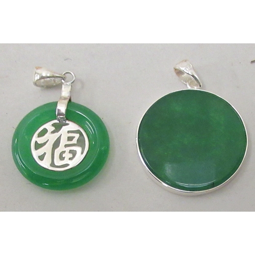 205 - Modern Oriental jade and white metal mounted jewellery, comprising two pairs of earrings and two dis... 