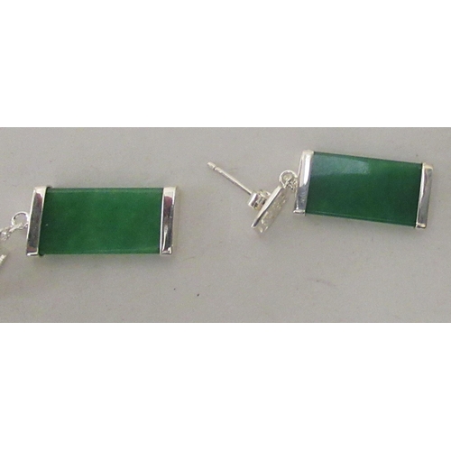 205 - Modern Oriental jade and white metal mounted jewellery, comprising two pairs of earrings and two dis... 