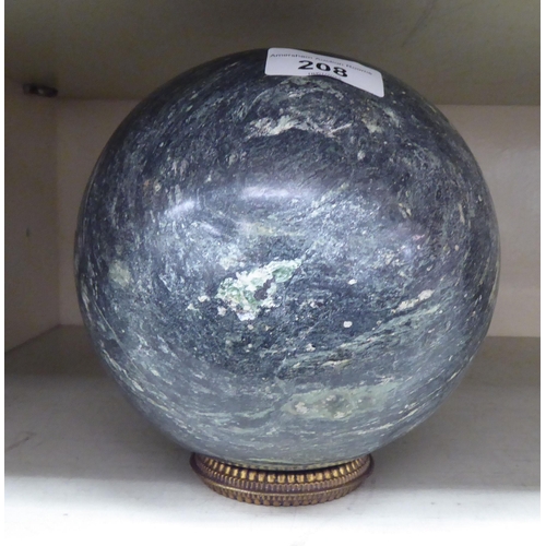 208 - A carved black and white mottled marble sphere  6