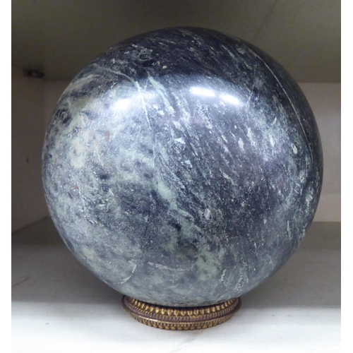 208 - A carved black and white mottled marble sphere  6