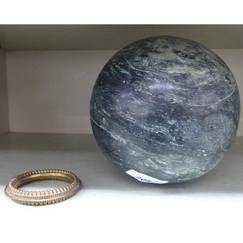 208 - A carved black and white mottled marble sphere  6