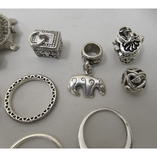 210 - Jewellery: to include silver coloured metal rings; Pandora charms; and two novelty pendant watches&n... 