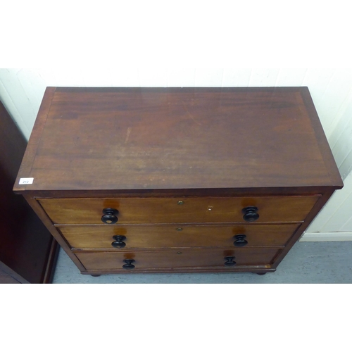 212 - A late 19thC mahogany three drawer dressing chest with bun handles, raised on turned feet  35