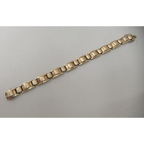 216 - A 9ct textured gold, block link bracelet 