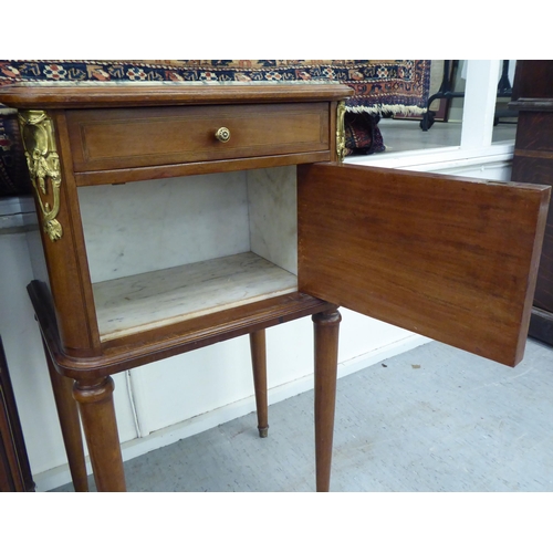 222 - Two similar early 20thC French mahogany bedside pot cupboards with marble tops, each with a shallow ... 