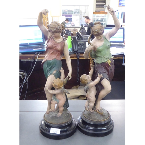 226 - A pair of late 19thC painted spelter female dancing figures, each on an ebonised plinth  19