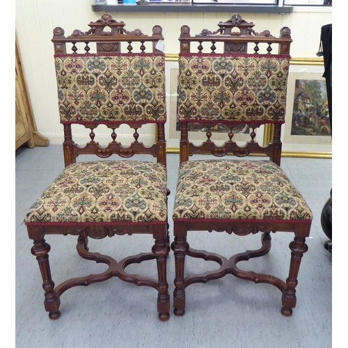 227 - A pair of late 19thC carved mahogany framed side chairs with tapestry upholstered backs and seats, r... 