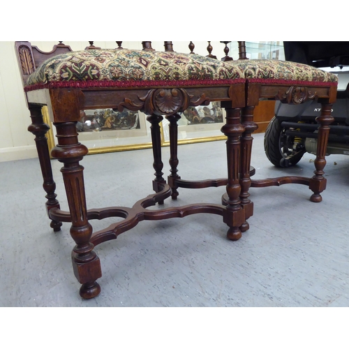 227 - A pair of late 19thC carved mahogany framed side chairs with tapestry upholstered backs and seats, r... 