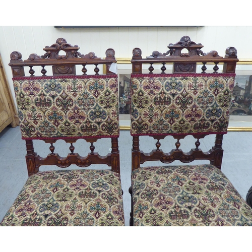 227 - A pair of late 19thC carved mahogany framed side chairs with tapestry upholstered backs and seats, r... 