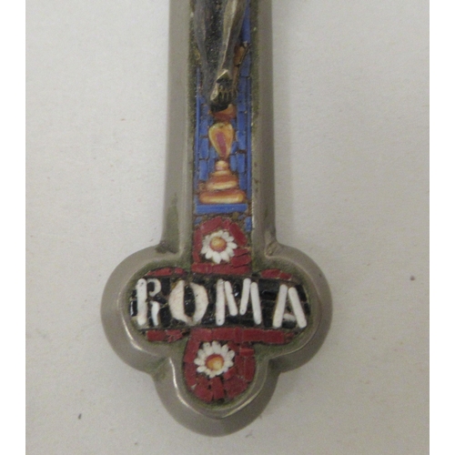 233 - A Continental white metal pendant crucifix, set with multi-coloured micro mosaic ornament  case... 