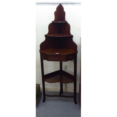 238 - A late Victorian mahogany corner washstand with two shelves and a drawer, raised on splayed legs&nbs... 