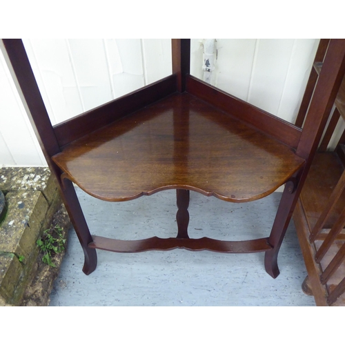 238 - A late Victorian mahogany corner washstand with two shelves and a drawer, raised on splayed legs&nbs... 