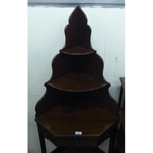 238 - A late Victorian mahogany corner washstand with two shelves and a drawer, raised on splayed legs&nbs... 