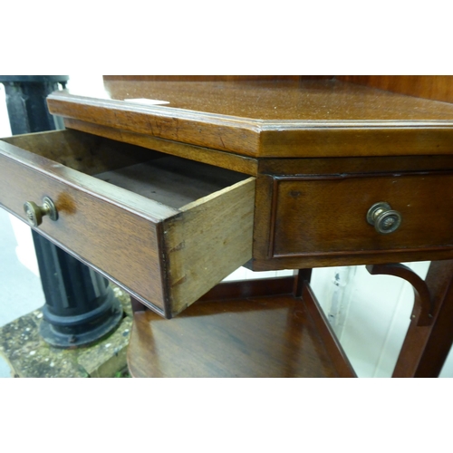 238 - A late Victorian mahogany corner washstand with two shelves and a drawer, raised on splayed legs&nbs... 