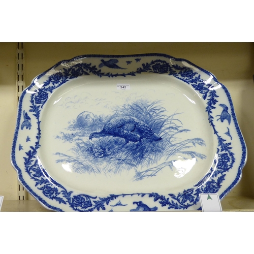 242 - A late Victorian china serving platter with a wavy edged border, decorate with game birds