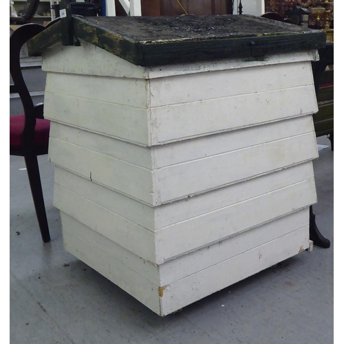 254 - A white painted wooden beehive  34